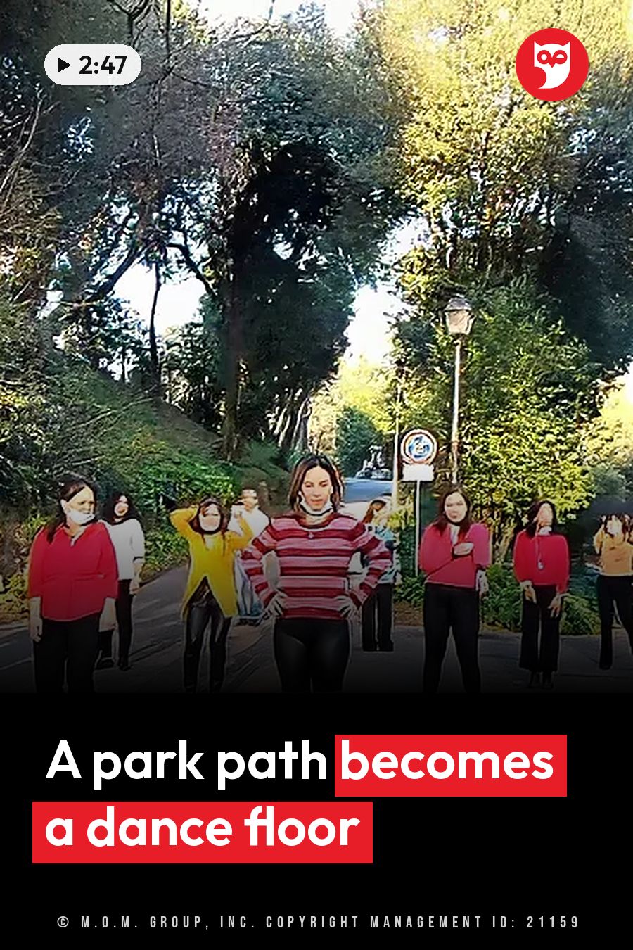 Several people stand on a tree-lined path near a street sign, some with hands on hips and some with arms raised. A headline runs in white letters across the lower third.