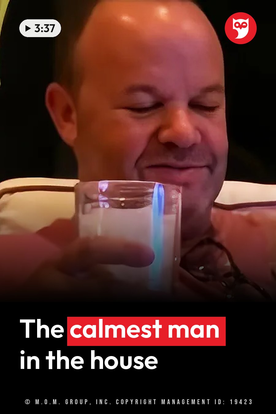 A seated man smiles slightly with his eyes closed as he holds a glass of liquid near his face. A headline runs in white letters across the lower third.