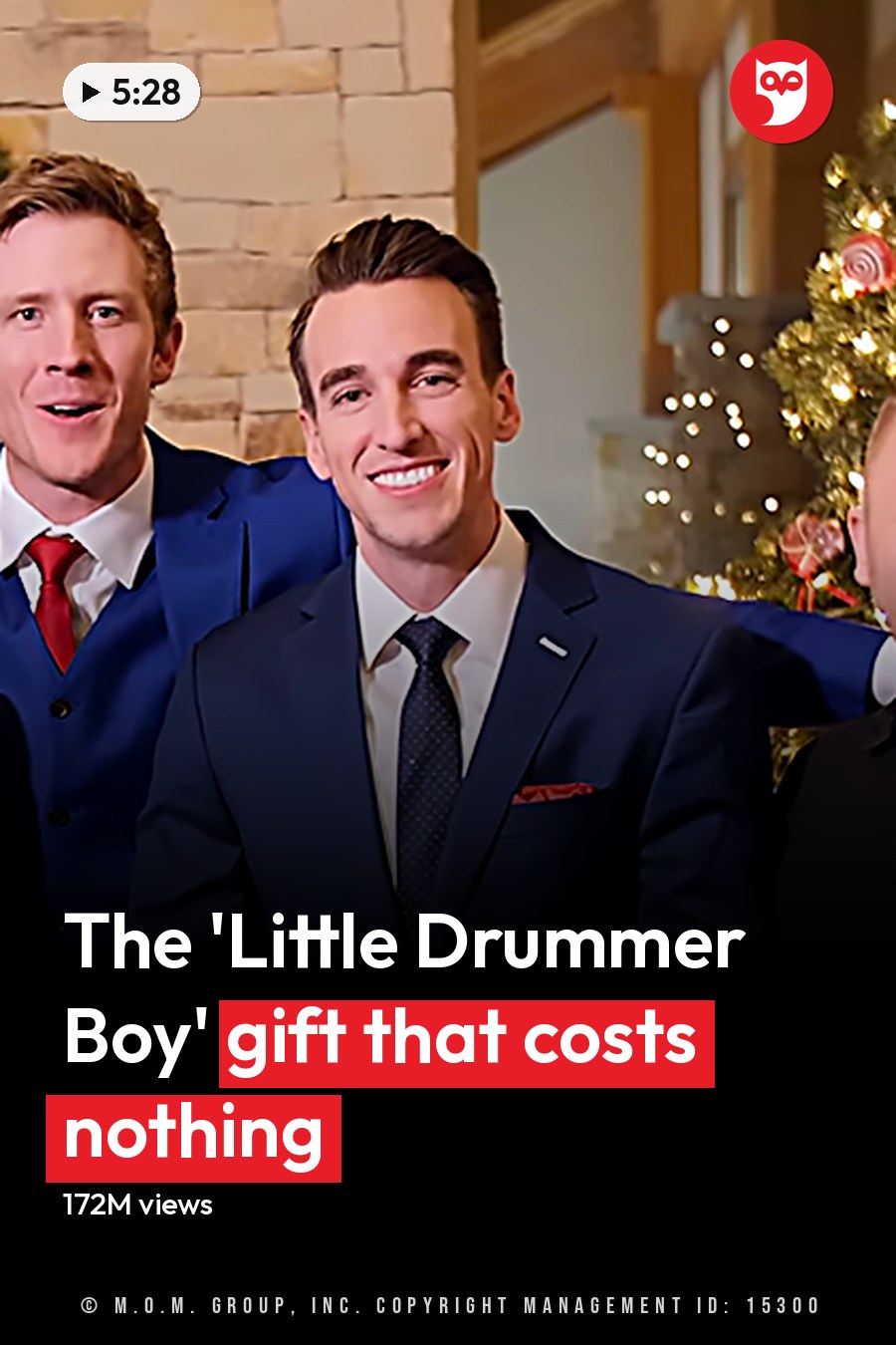 A group photo of young adult males in festive attire, including button-up shirts, suits with ties and pocket squares, gathered indoors against a backdrop decorated for the holidays. A guitar is held by one individual. The headline runs in white letters across the lower third.