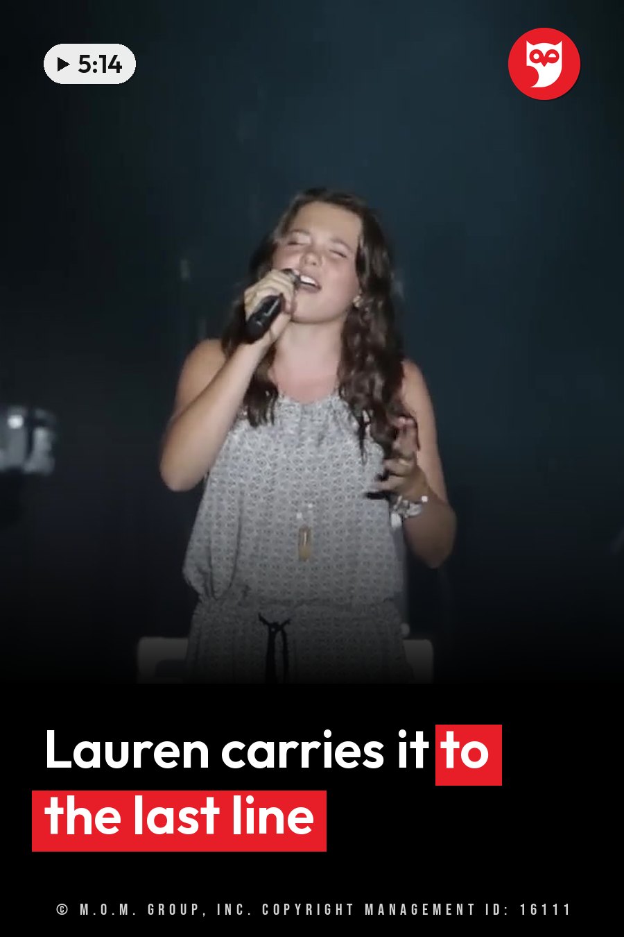Lauren Spencer-Smith, with long hair and a patterned dress, sings into a microphone on a dark stage. A headline runs in white letters across the lower third.