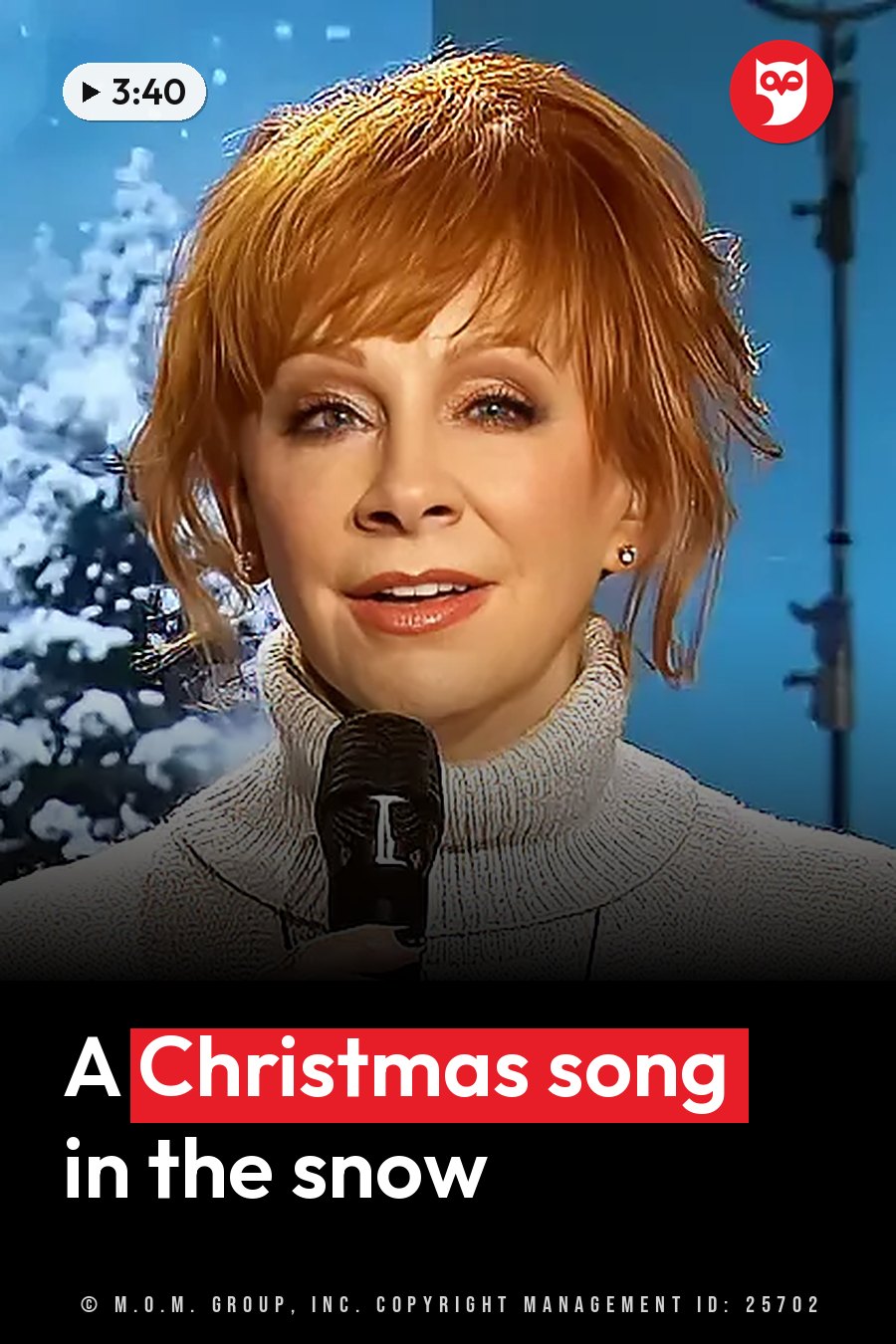 Reba McEntire, in a white turtleneck sweater, holds a microphone in front of a snowy backdrop. A headline runs in white letters across the lower third.