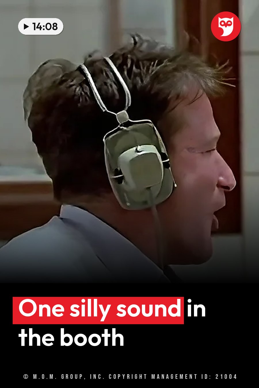 A man wearing headphones has his mouth open at a microphone, as if speaking or singing into it. A headline runs in white letters across the lower third.