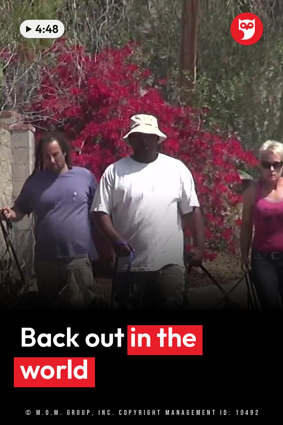 Three people walk together outdoors; one wears a hat, one has dreadlocks and one has blonde hair. A headline runs in white letters across the lower third.