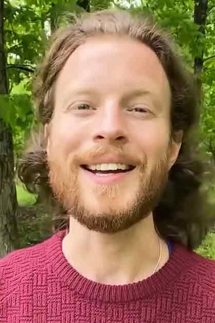 A young adult male in a maroon sweater outdoors with lush greenery, transitioning to an older adult female wearing glasses indoors in a cozy cabin setting.