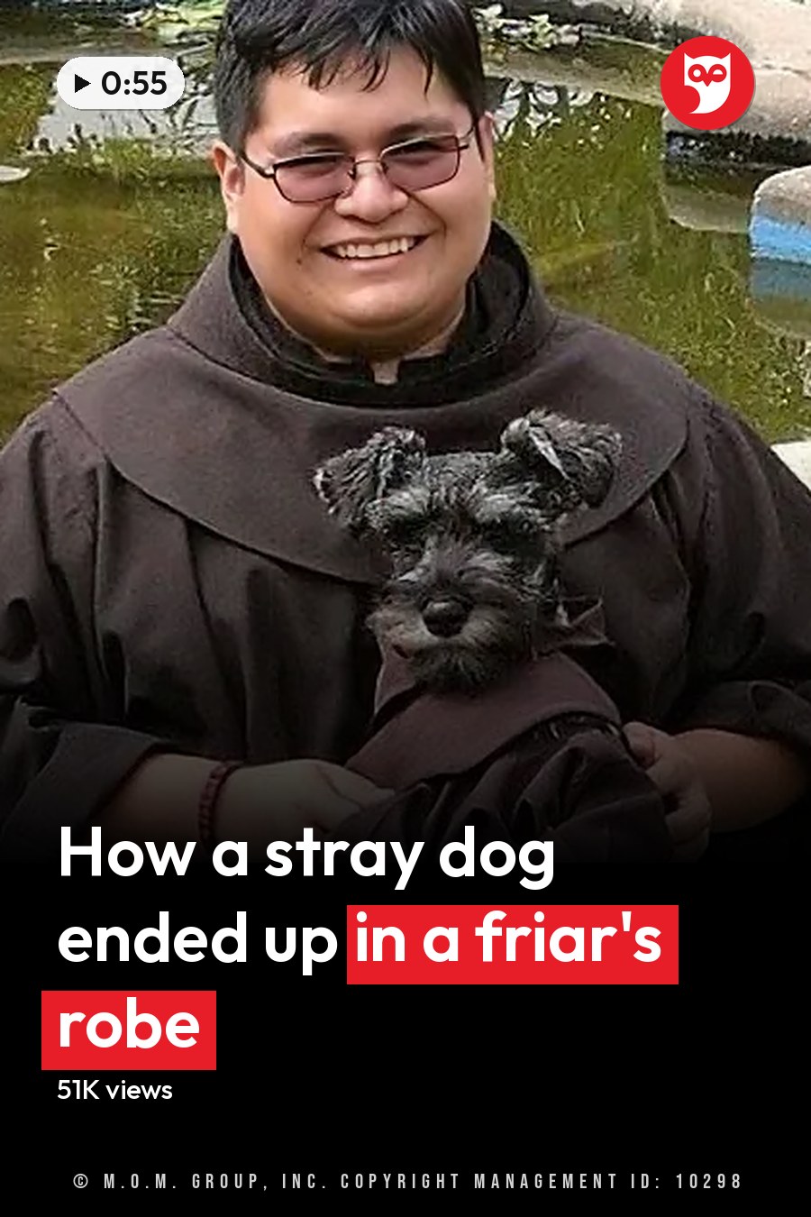 A small dog in a monk's robe sits beside a person also dressed as a monk near a pond. The headline runs in white letters across the lower third.