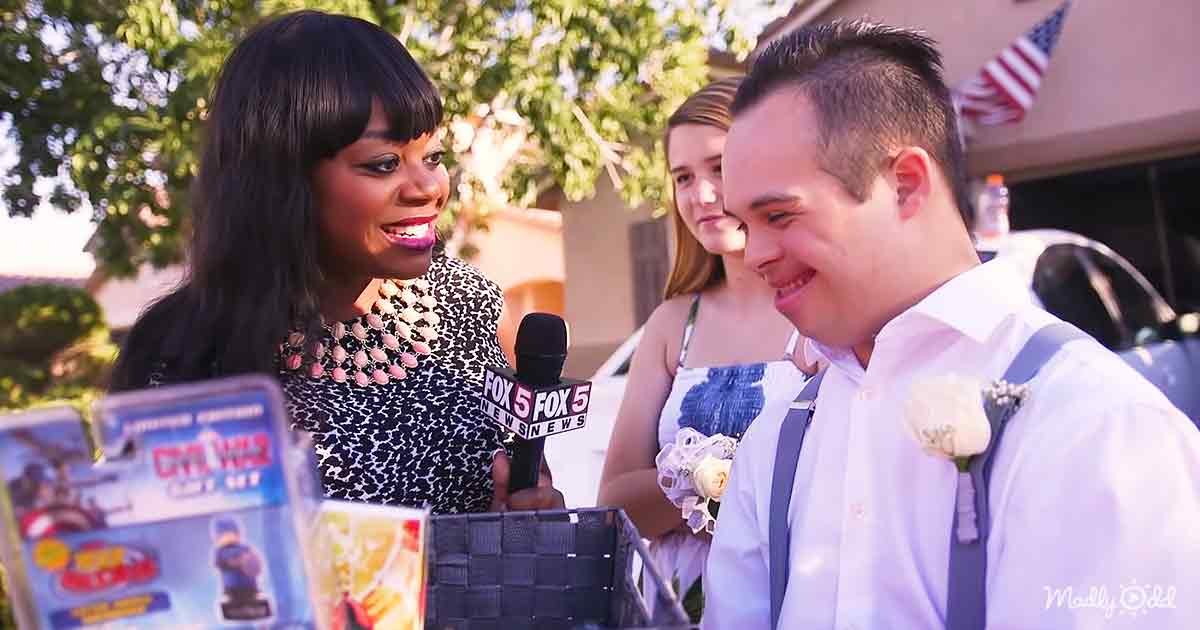 A young adult female news reporter in a black and white patterned dress interviews a young man wearing a white shirt with suspenders and a boutonniere, set against the backdrop of a suburban neighborhood with lush greenery and an American flag visible.