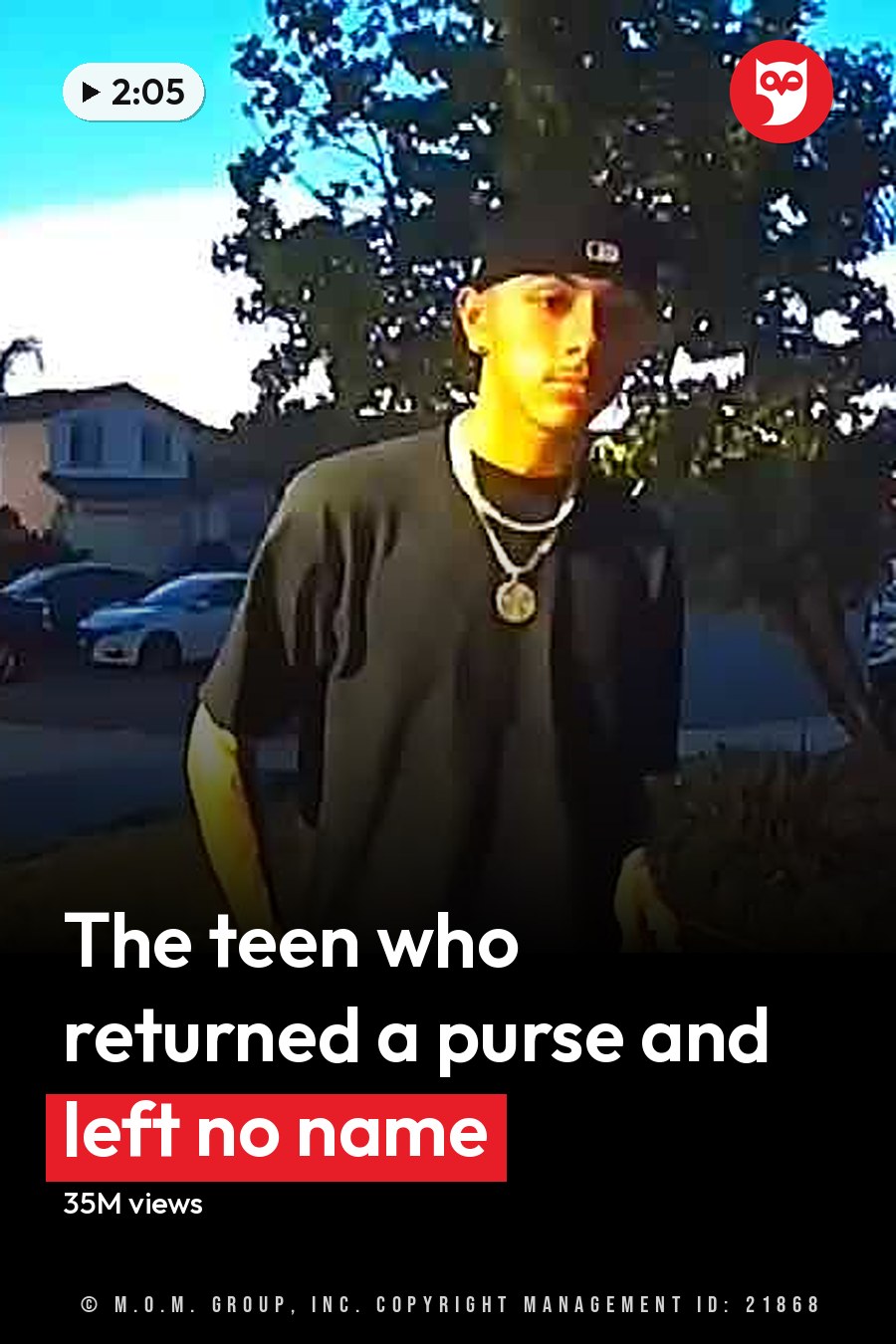 A young adult male in a residential neighborhood, wearing a black t-shirt with dark jeans and a silver chain necklace, holding a green plastic bag on the sidewalk. The headline runs in white letters across the lower third.