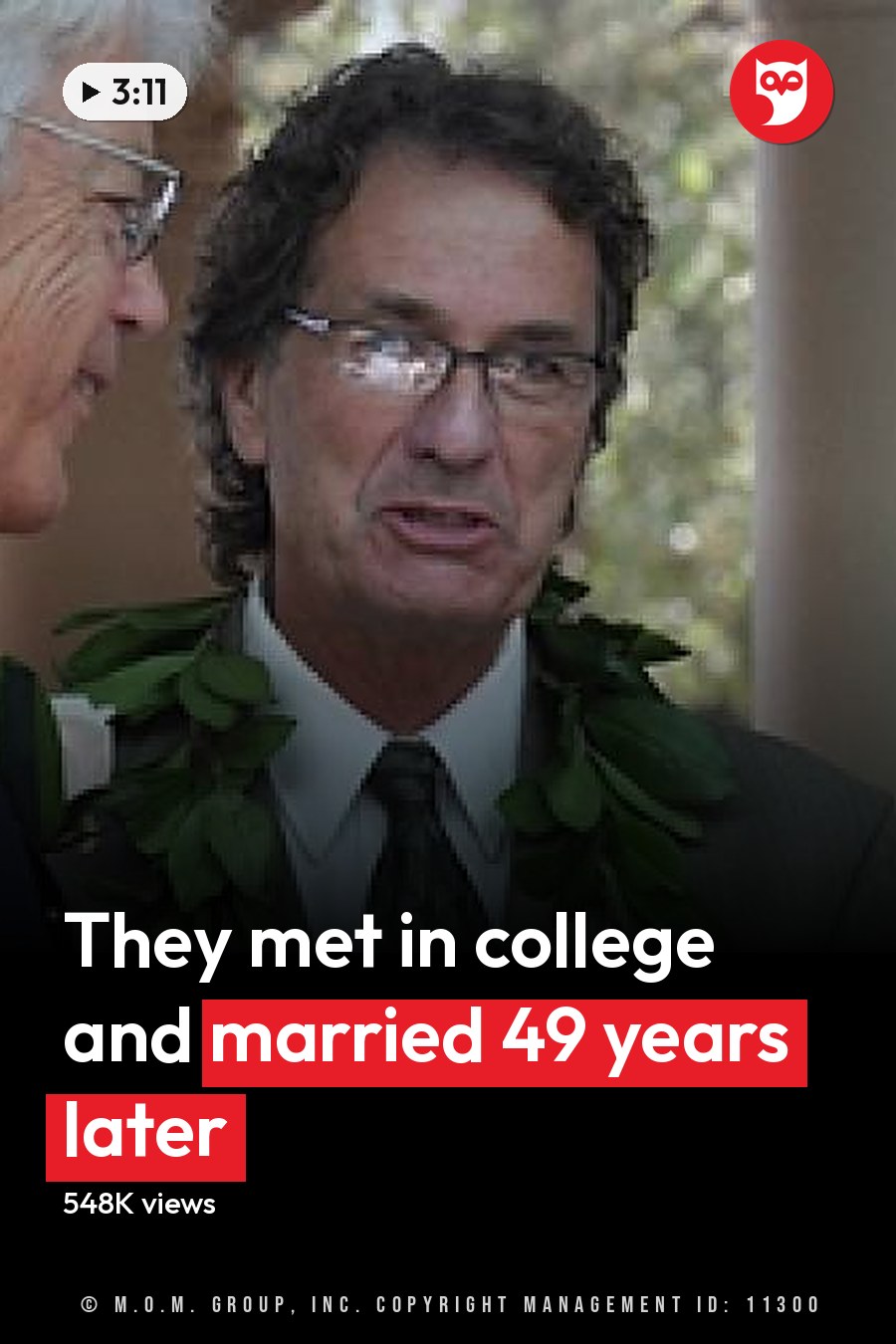 A wedding ceremony outdoors with columns in the background. A middle-aged man wearing a light-colored suit jacket, patterned tie, and lei holds what appears to be a book or document. An older adult female wears glasses, a white lace dress with floral embellishments, and a pearl necklace. The headline runs in white letters across the lower third.