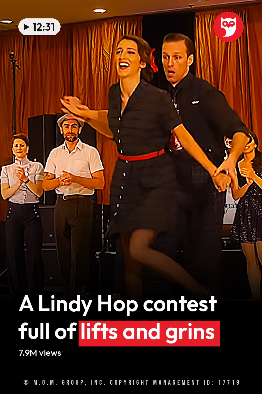 A couple dancing swing in front of an audience at the International Lindy Hop Championships 2021, with a banner reading 'International Lindy Hop Championships,' curtains, and microphones visible. The headline runs in white letters across the lower third.
