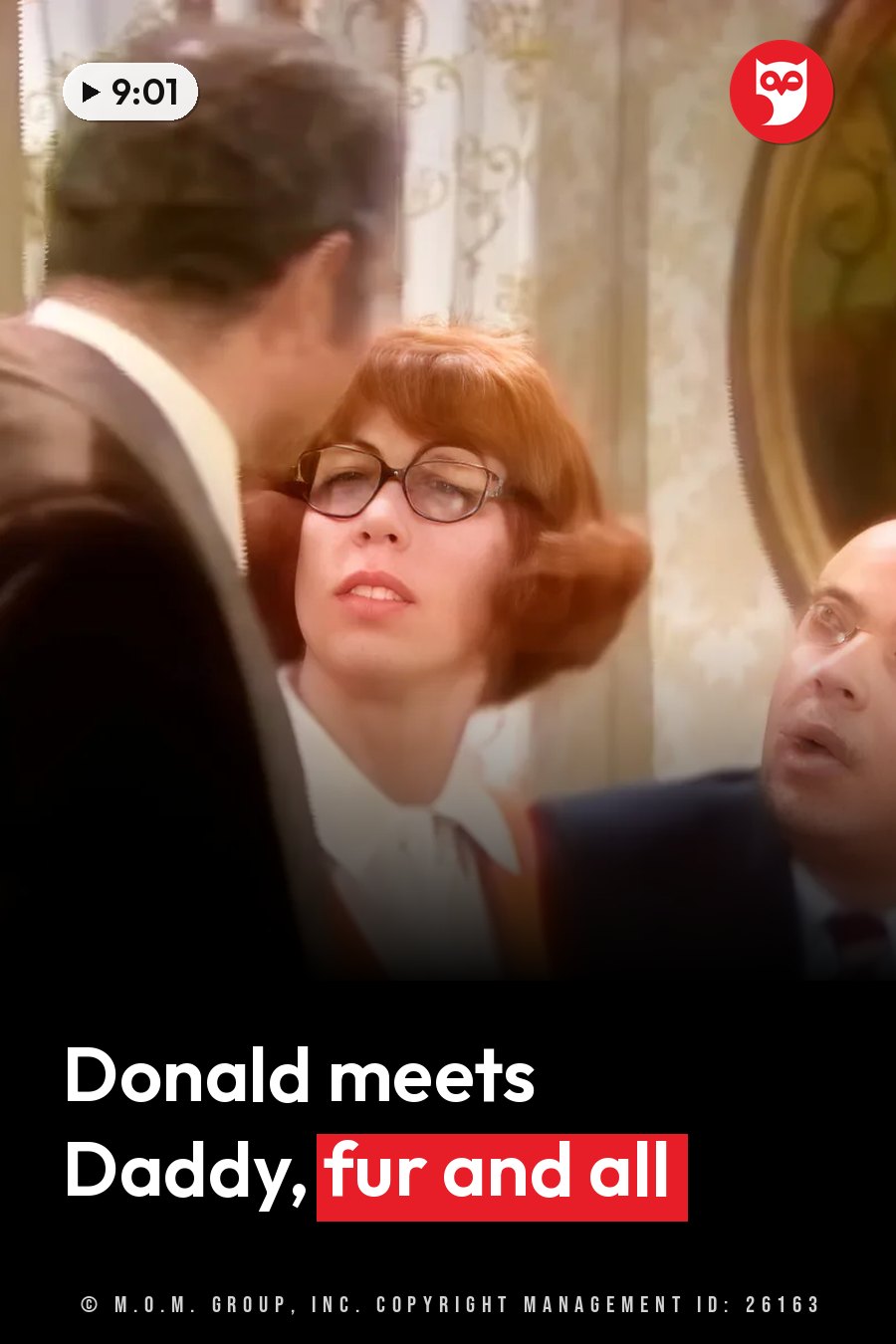 Bobo, in glasses, looks up while two men stand close to her and face her. A headline runs in white letters across the lower third.