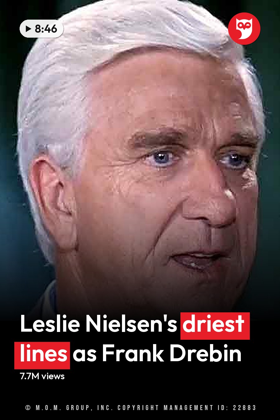 An older adult male in a tailored dark gray suit jacket and light blue collared shirt, set against a dark green curtain backdrop. The headline runs in white letters across the lower third.