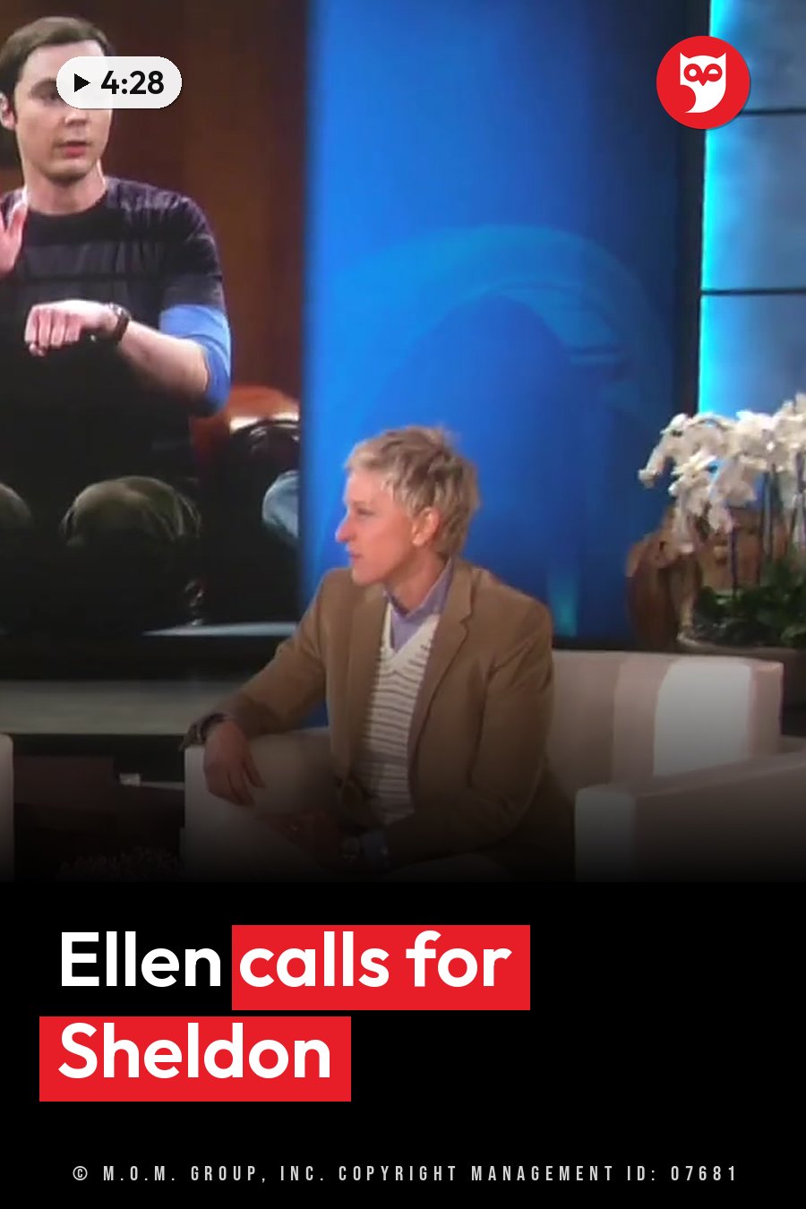 Two people sit on a talk show set; one gestures while speaking and the other listens. A headline runs in white letters across the lower third.
