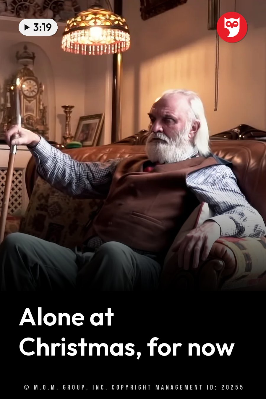 An elderly man with white hair sits on a leather couch, holding a cane and looking off to the side. A headline runs in white letters across the lower third.
