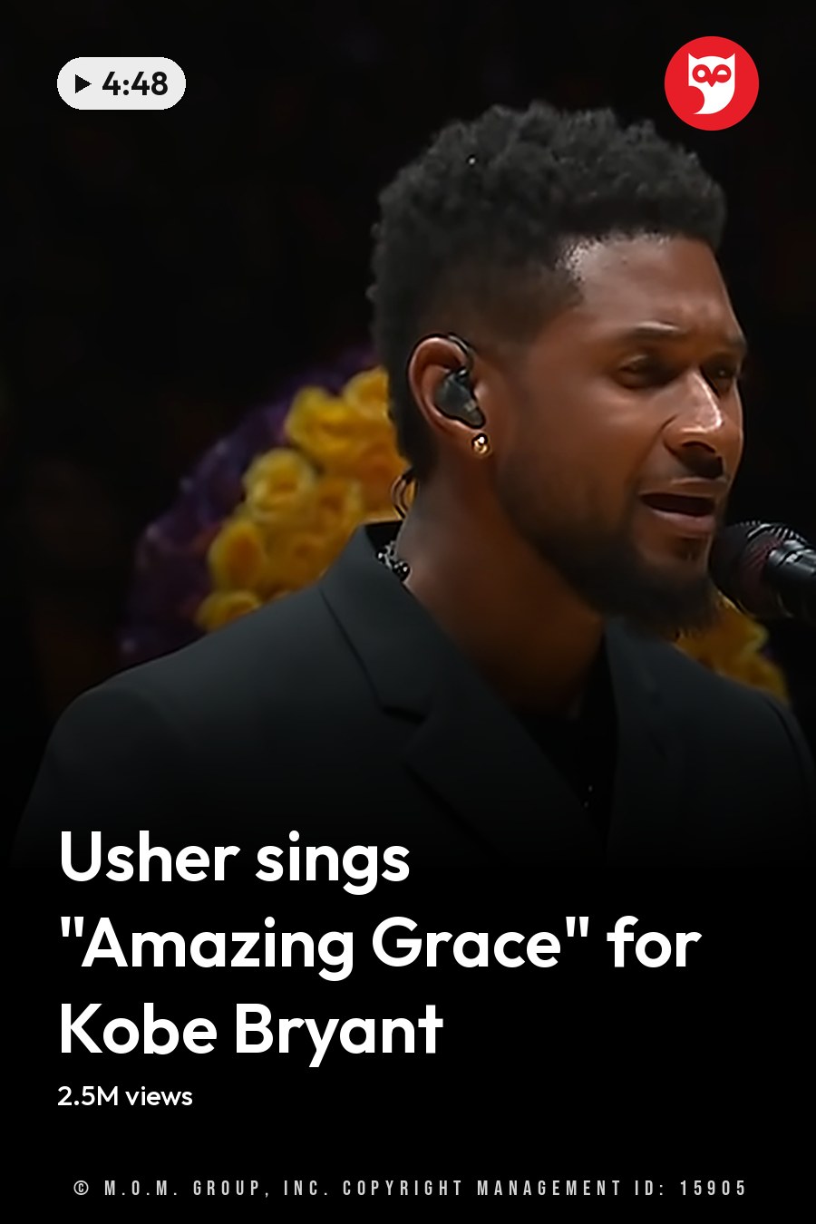 A young adult male performer in a dark gray suit jacket, possibly at an indoor memorial service. Large floral tributes with the number '24' are prominently displayed in the background. The headline runs in white letters across the lower third.