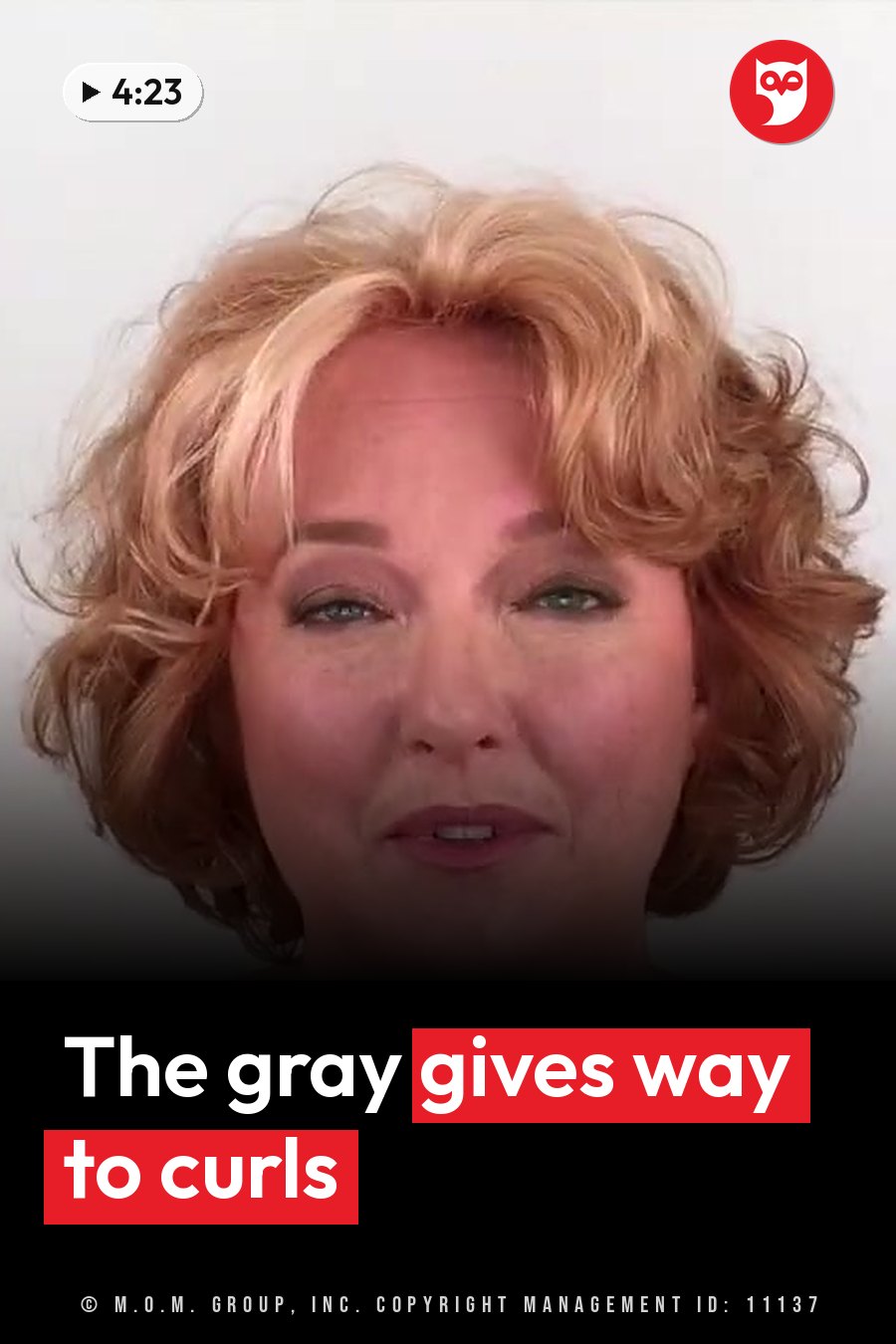 A woman with short curly blonde hair faces forward with a slight smile against a plain white background. A headline runs in white letters across the lower third.
