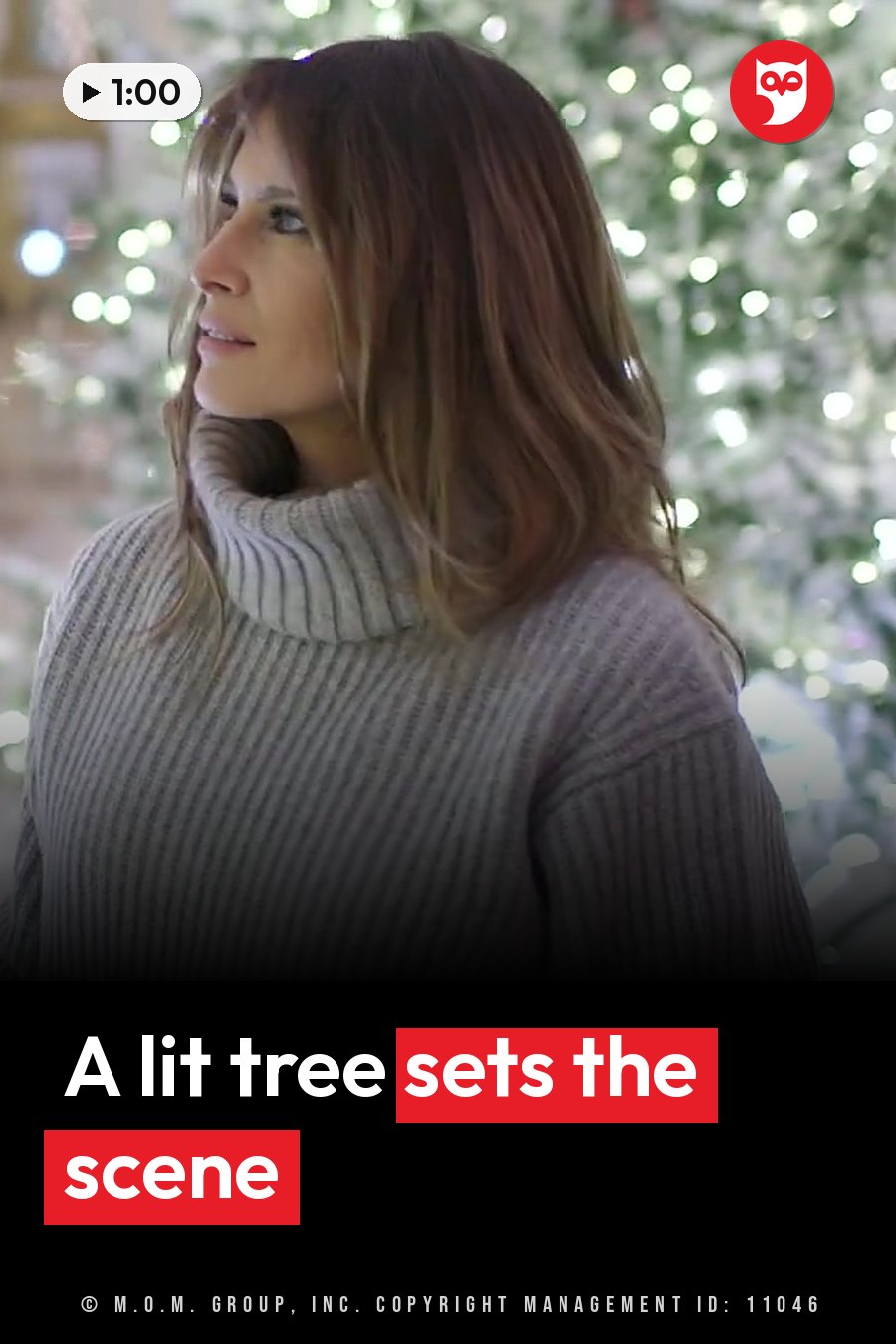 A woman with shoulder-length hair in a ribbed turtleneck sweater looks off to the side near a lit tree. A headline runs in white letters across the lower third.