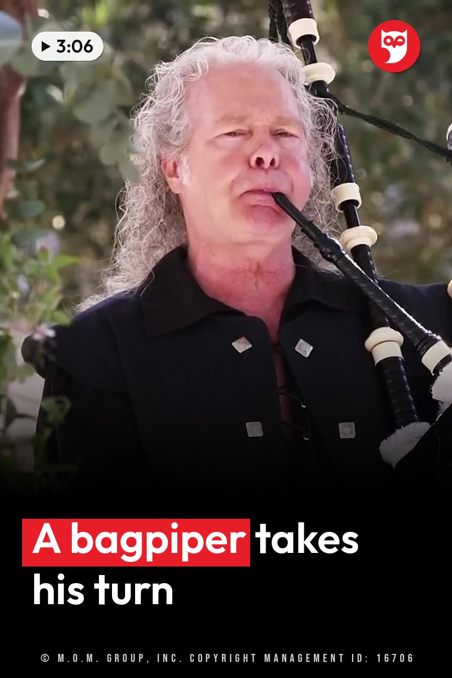 A man with long white hair plays bagpipes outdoors, wearing a black jacket with silver buttons. A headline runs in white letters across the lower third.