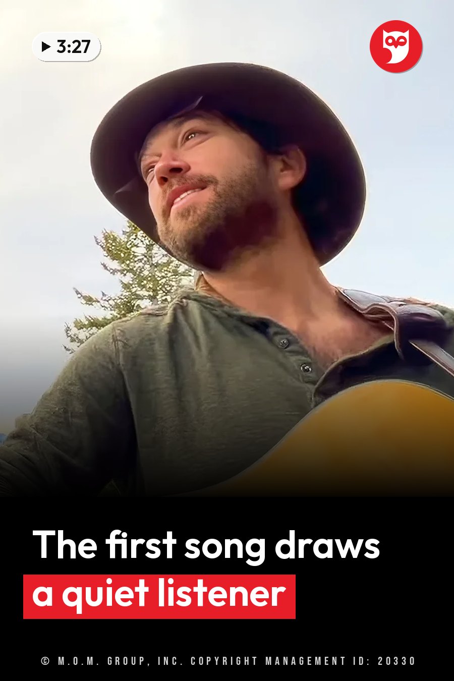 A bearded man in a hat holds a guitar and looks up at the sky, with a tree behind him. A headline runs in white letters across the lower third.