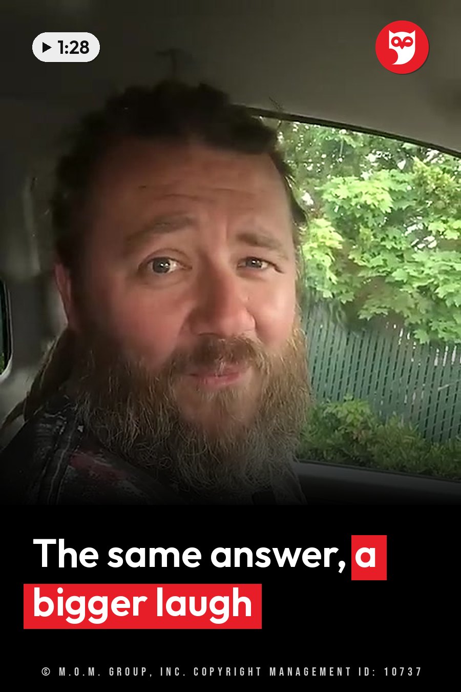 A bearded man sits in a car, looking ahead through the window at green leaves outside. A headline runs in white letters across the lower third.