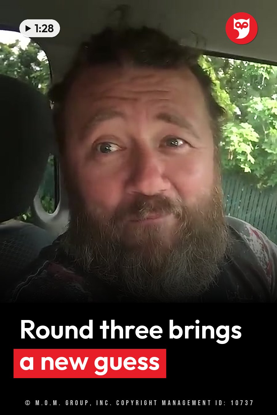 A bearded man sits in a vehicle and looks out through the windshield at green trees. A headline runs in white letters across the lower third.