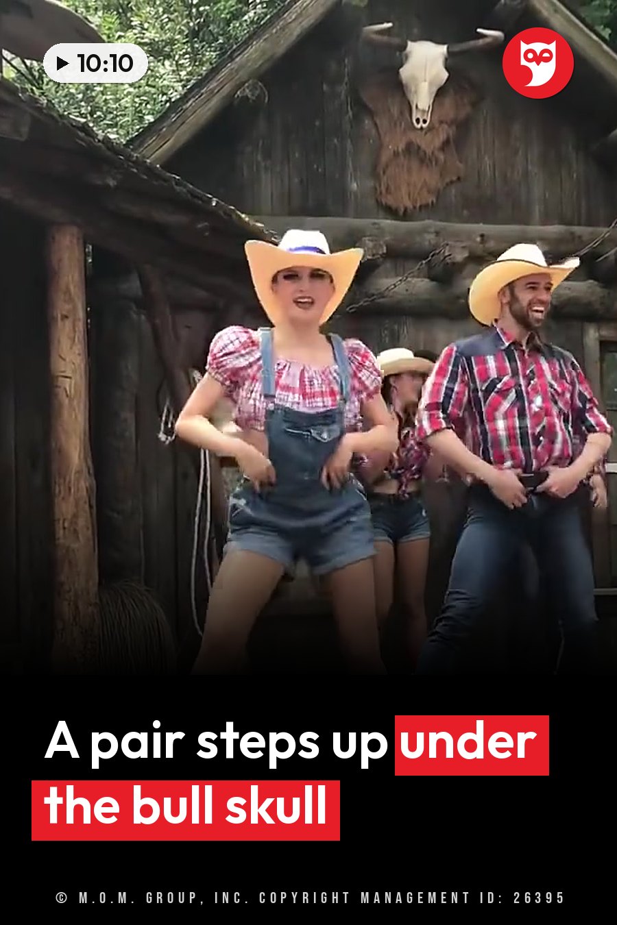 Two people in cowboy hats dance outside a wooden building with a bull skull mounted above it. A headline runs in white letters across the lower third.
